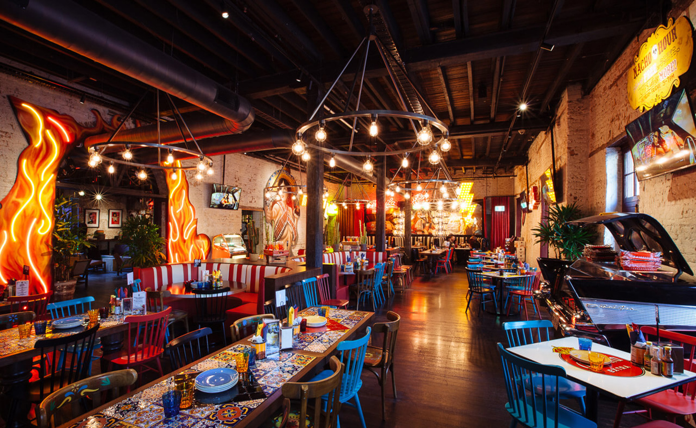 Reference image of the El Camino restaurant in Australia, featuring numerous light fittings and chandeliers