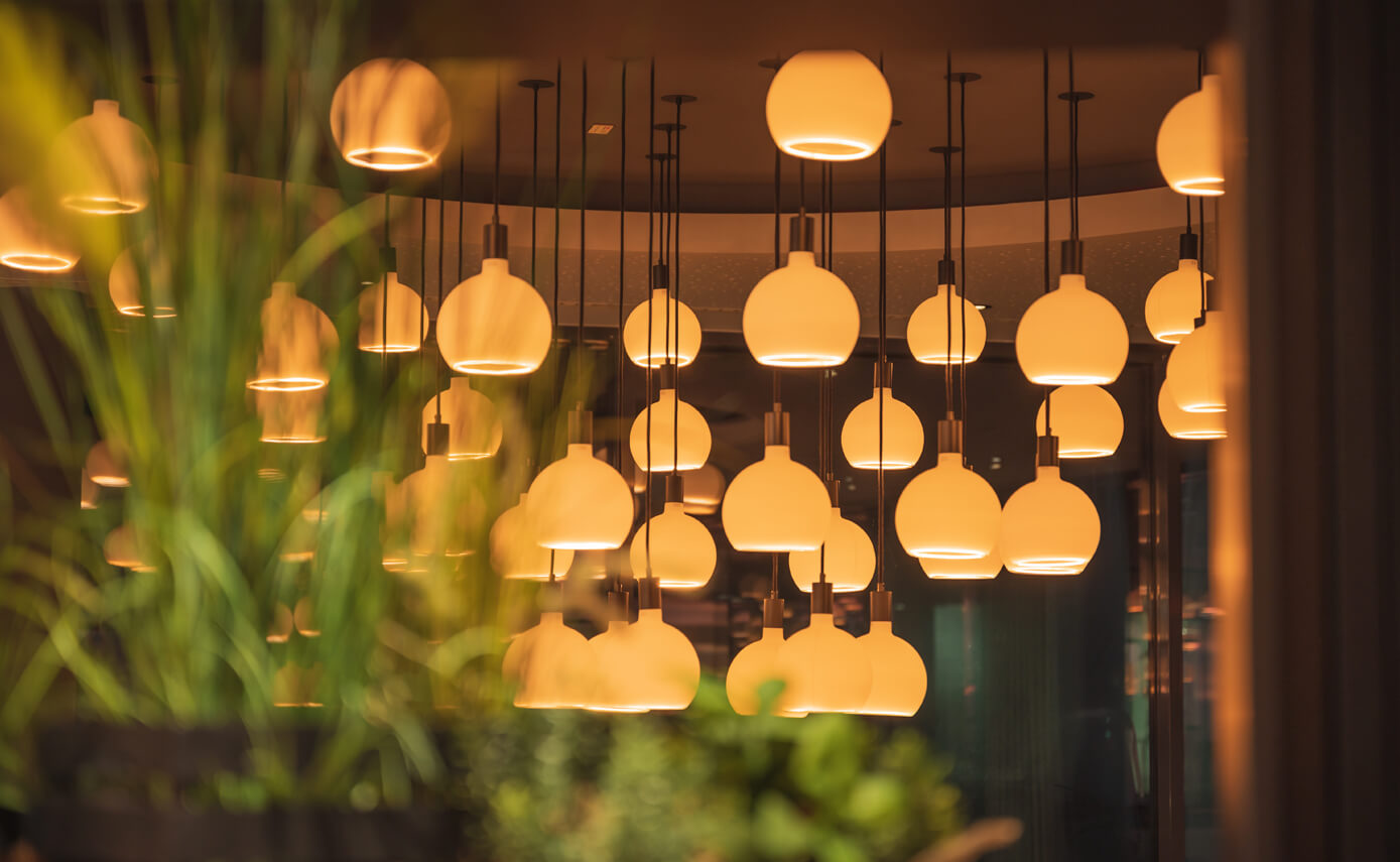 Reference image from lighting designer Maximales Licht: Bakers bakery, featuring numerous matt floating light fittings