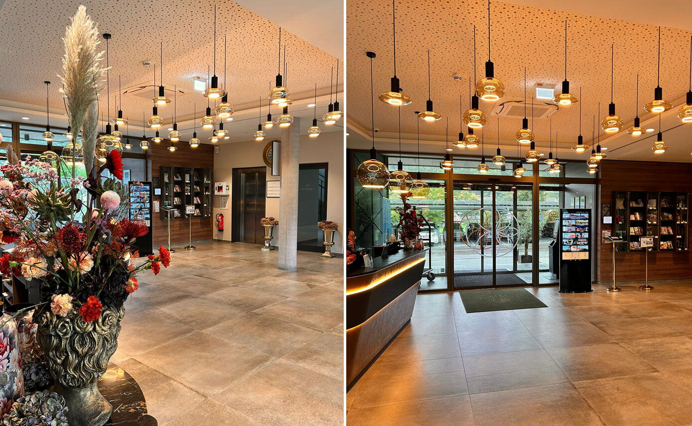 Reference image of the Karlshotel in Sigmaringen, foyer featuring a variety of floating light fittings